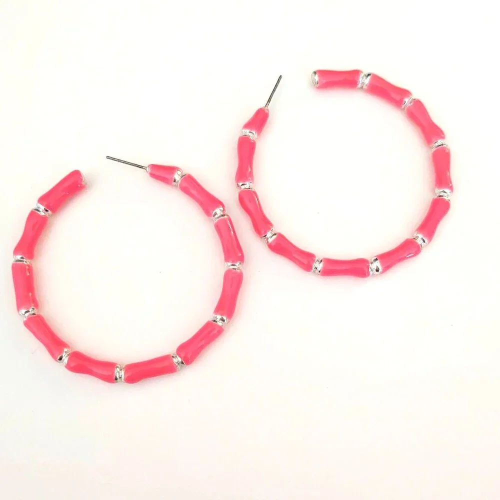 Bright glossy salmon pink enamel and silver tone hoops